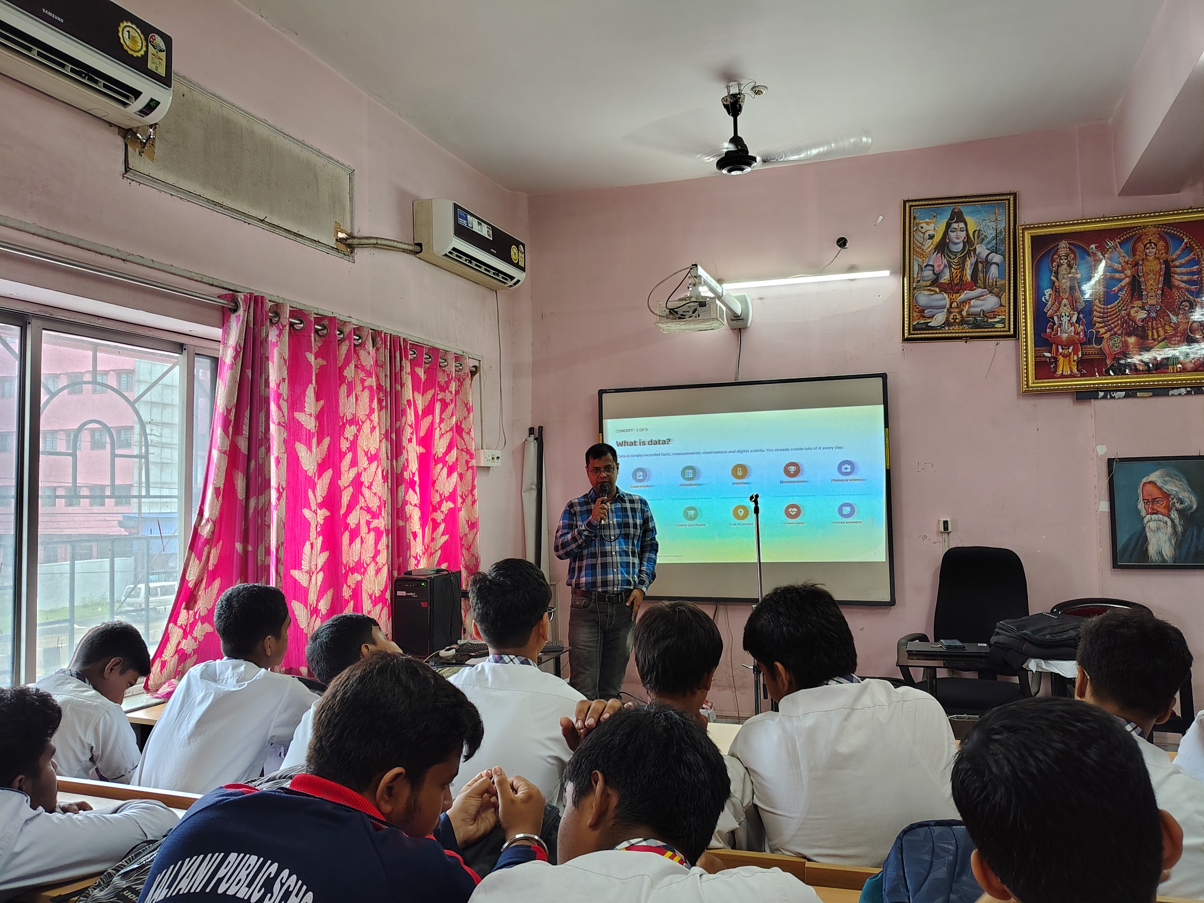 Projector slide explaining where data comes from during the MAVI Foundation workshop at Kalyani Public School, Barasat, 2026 (photo 6 of 16)