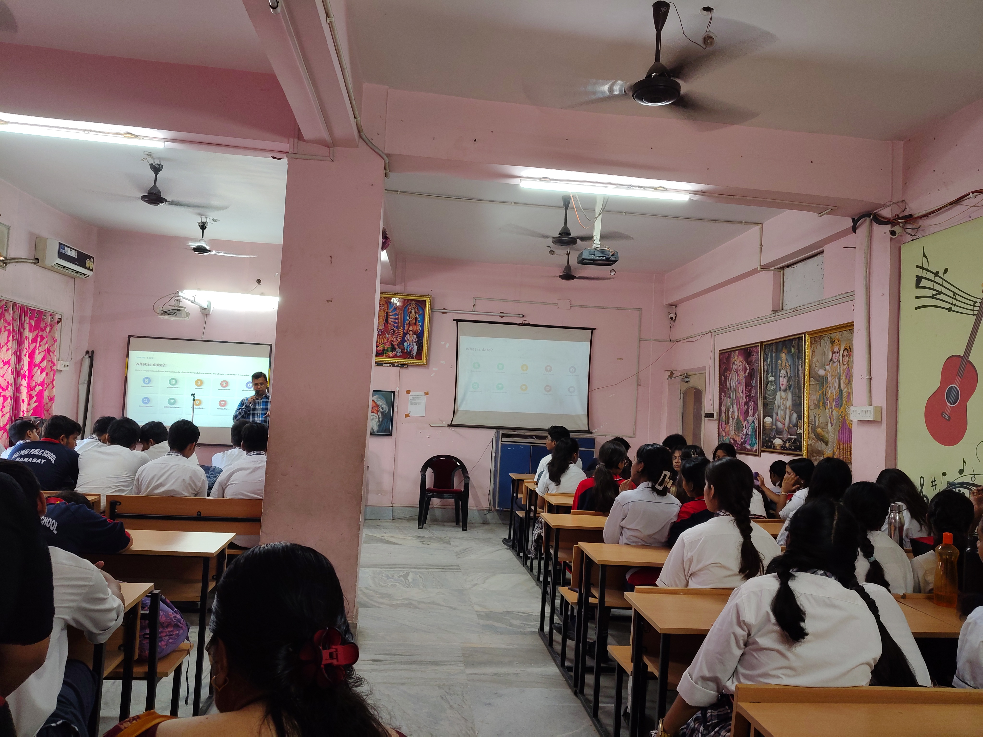 Wide view of the hall with the presentation on screen at the MAVI Foundation workshop, Kalyani Public School, Barasat, 2026 (photo 8 of 16)