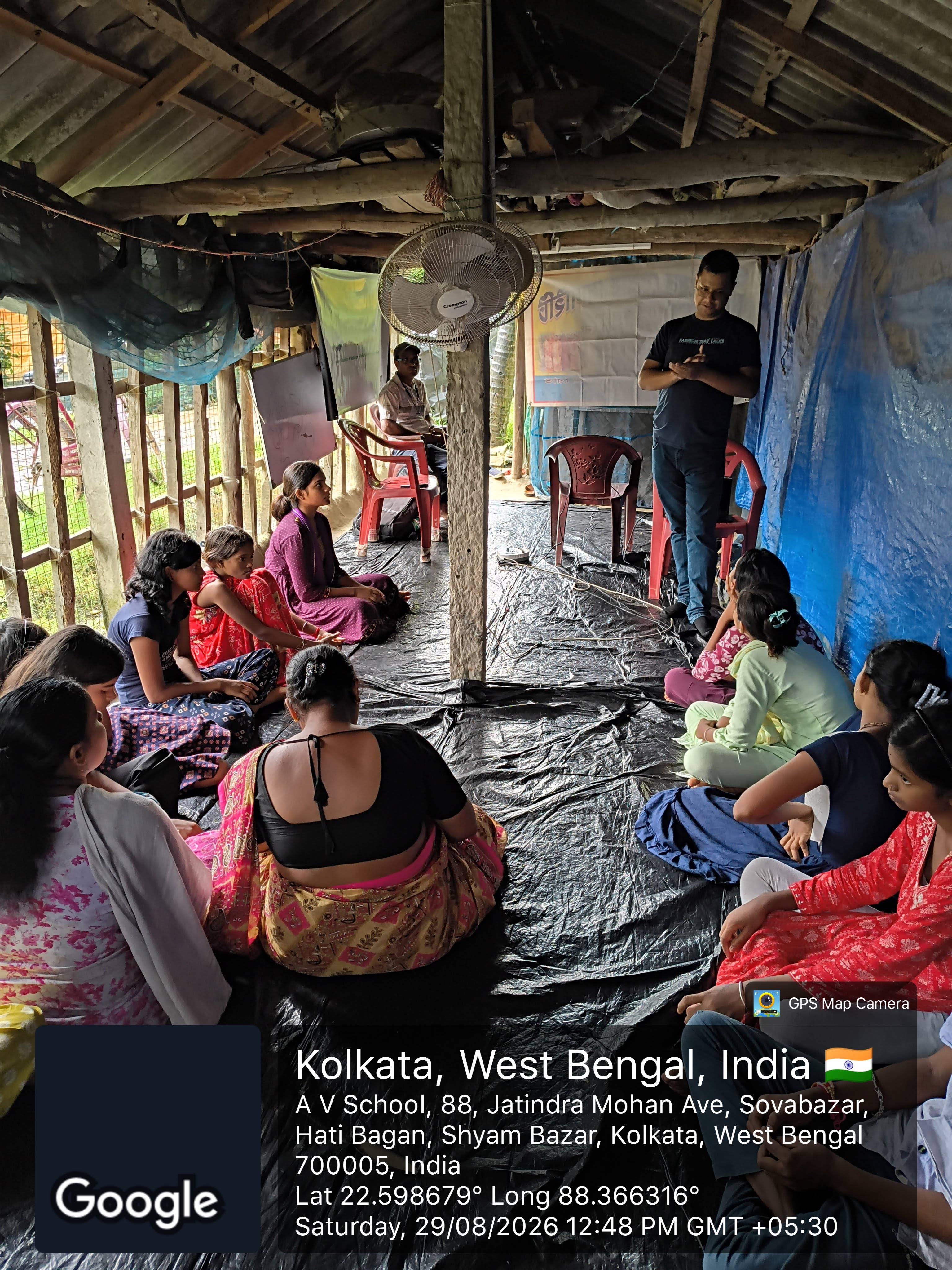 Children seated on the floor in a circle as the MAVI Foundation cyber fraud awareness session opens at a rural pathsala in Gosaba Block, Sundarbans, 2026 (photo 2 of 8)