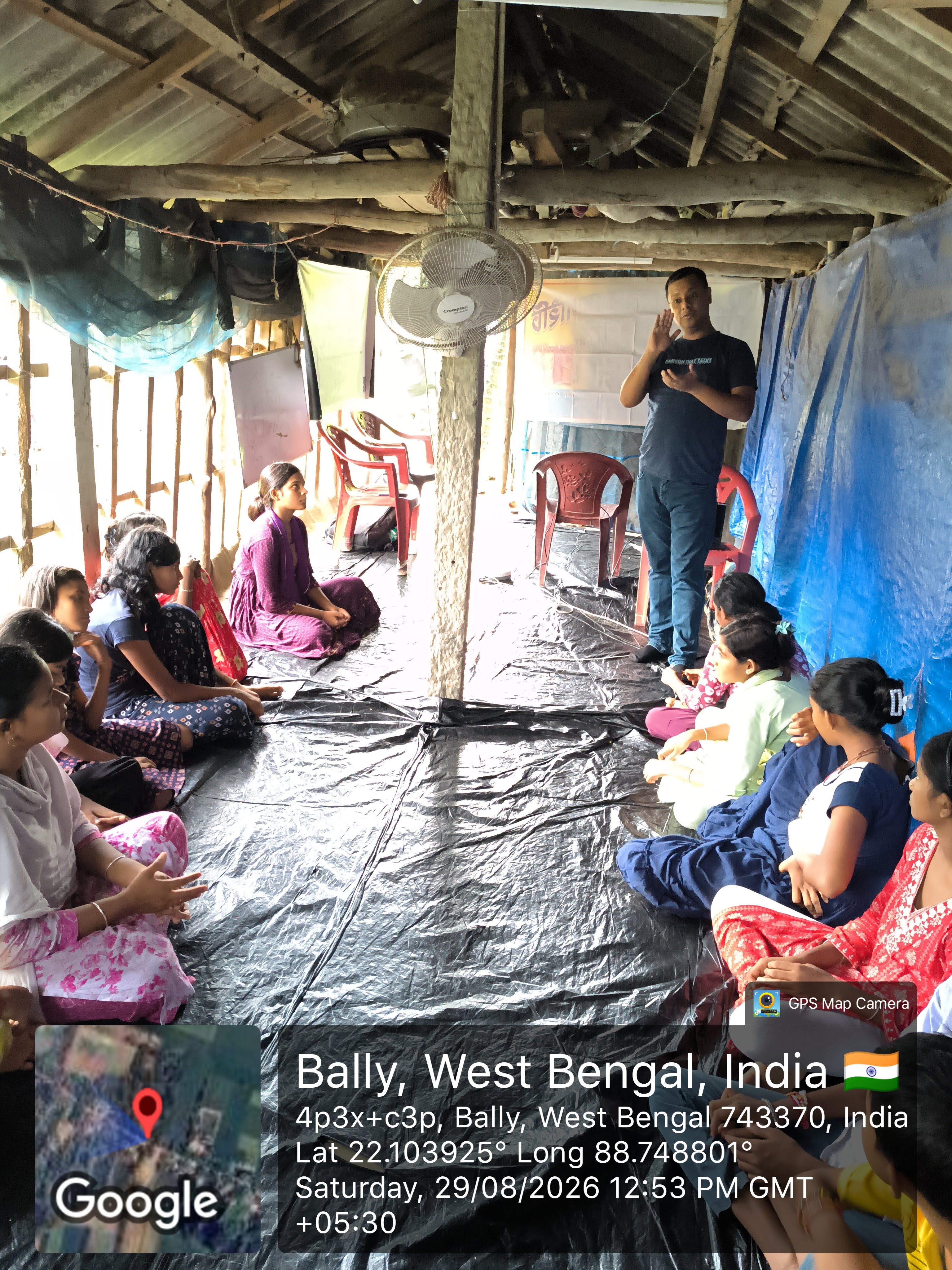 MAVI Foundation presenter teaching the never-share-your-OTP rule to children in Gosaba Block, Sundarbans, 2026 (photo 4 of 8)
